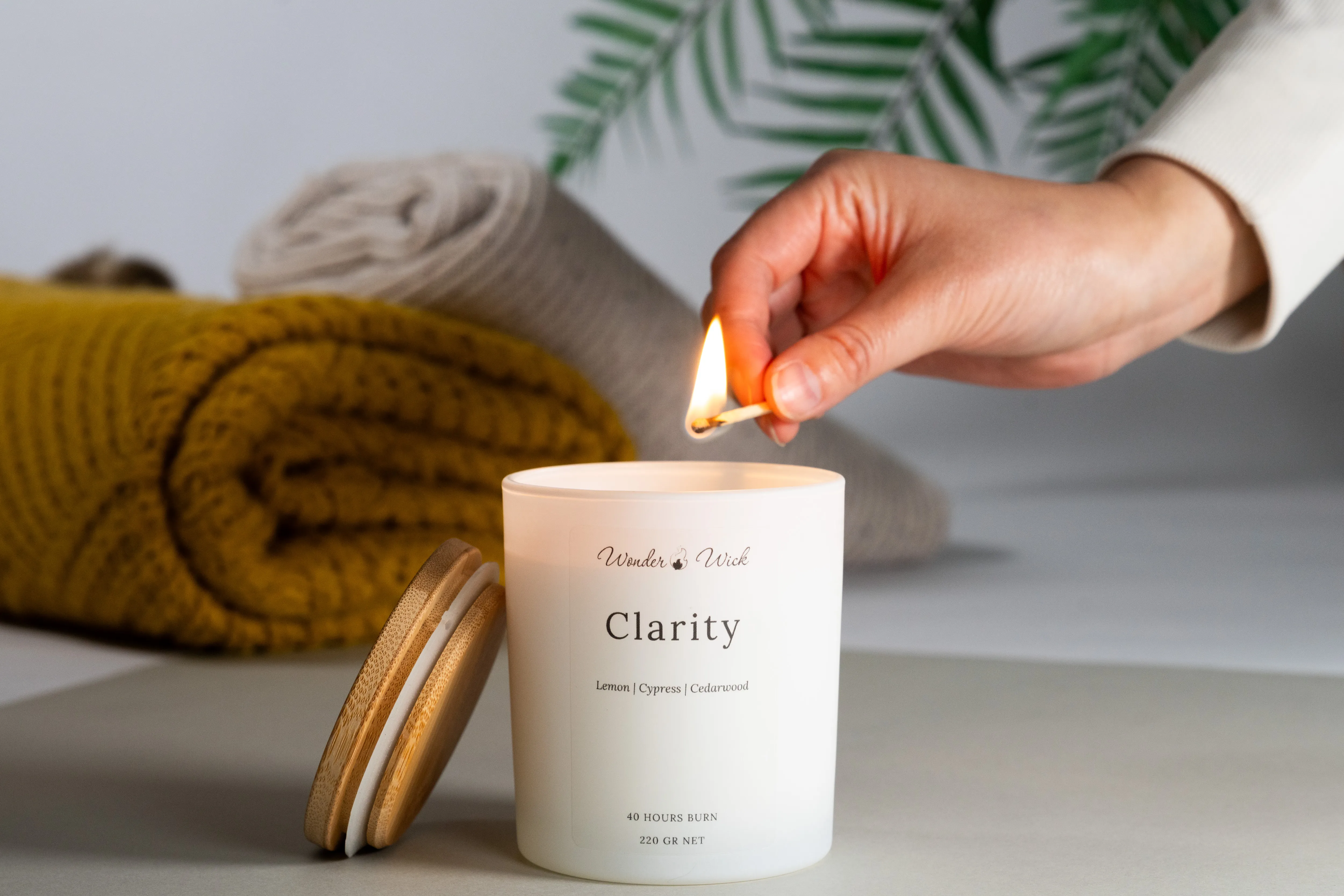 A Wonder Wick candle being lit at home